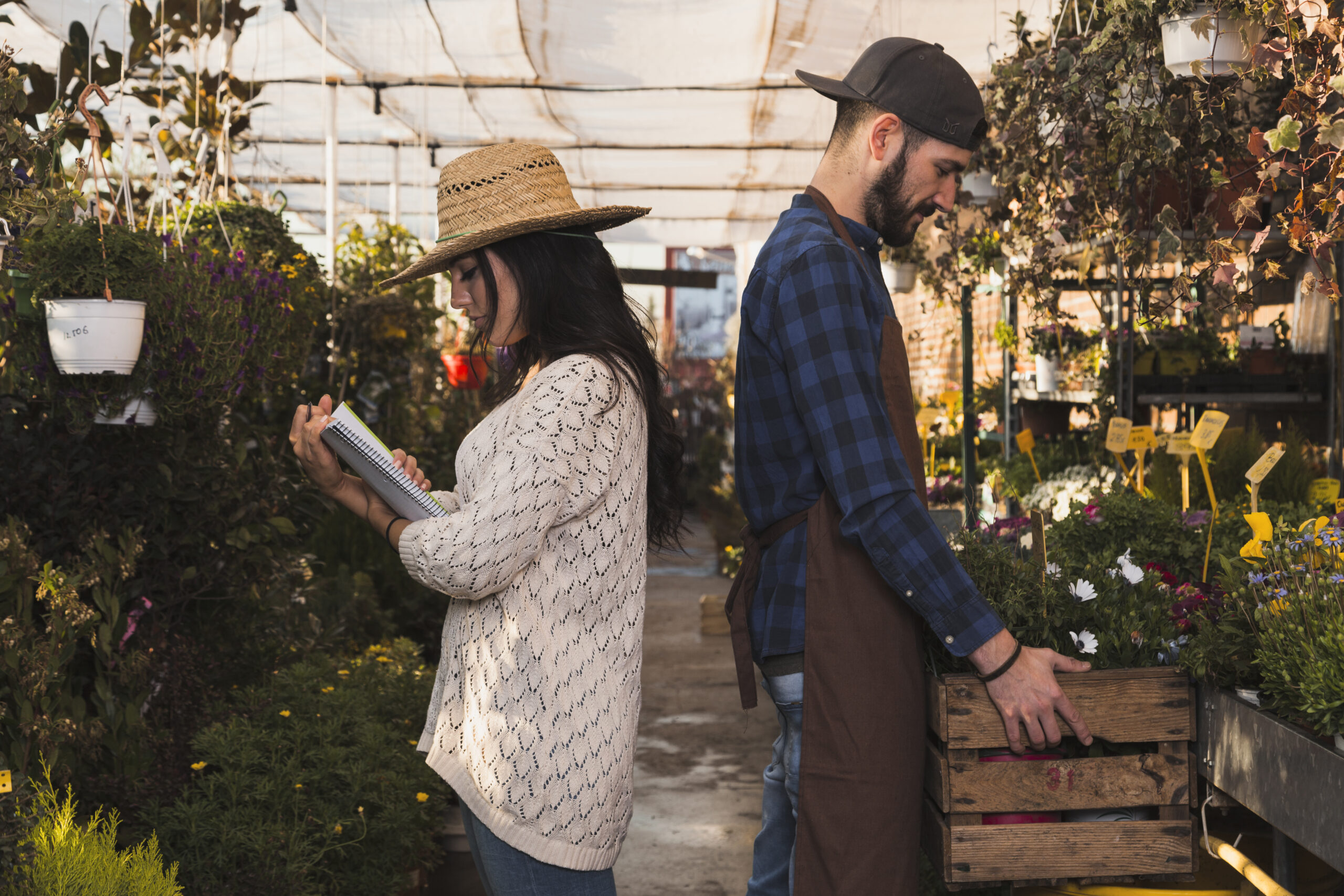 side-view-people-working-greenhouse